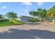 Wide street shot of a well-landscaped single-story home in a quiet neighborhood at 2607 Lancaster Dr # 35, Sun City Center, FL 33573