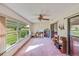 Bright sunroom with scenic outdoor views through expansive windows at 2607 Lancaster Dr # 35, Sun City Center, FL 33573