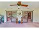 Sunroom with sliding doors that offers views of living and kitchen at 2607 Lancaster Dr # 35, Sun City Center, FL 33573