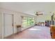 Sunroom with large windows and view of the yard at 2607 Lancaster Dr # 35, Sun City Center, FL 33573