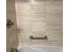 Relaxing bathroom with a soaking tub and tiled walls at 2616 Hidden Lake N Dr # A, Sarasota, FL 34237