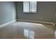 Bright bedroom with window and tile flooring at 2616 Hidden Lake N Dr # A, Sarasota, FL 34237