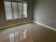 Bright bedroom with window and tile flooring at 2616 Hidden Lake N Dr # A, Sarasota, FL 34237