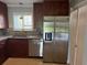 Modern kitchen with stainless steel appliances and granite countertops at 2616 Hidden Lake N Dr # A, Sarasota, FL 34237
