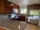 Modern kitchen with stainless steel appliances and granite countertops at 2616 Hidden Lake N Dr # A, Sarasota, FL 34237
