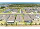 Aerial view of homes with lake and community amenities at 2926 61St E Dr, Ellenton, FL 34222