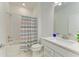 Bathroom featuring tub/shower with stylish curtain and single sink vanity at 2926 61St E Dr, Ellenton, FL 34222