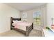 Well-lit bedroom with two windows, neutral carpet, and stylish furnishings at 2926 61St E Dr, Ellenton, FL 34222