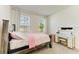 Well-lit bedroom with two windows, neutral carpet, and stylish furnishings at 2926 61St E Dr, Ellenton, FL 34222