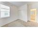 Neutral bedroom showcasing plush carpet and sliding door closet at 2926 61St E Dr, Ellenton, FL 34222