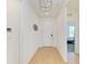 Bright entryway with hardwood floors and modern lighting, creating a welcoming ambiance at 2926 61St E Dr, Ellenton, FL 34222