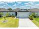 Charming single-story home with a well-manicured lawn and a two-car garage, perfect for curb appeal at 2926 61St E Dr, Ellenton, FL 34222