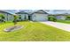 Single-story home featuring a well-maintained lawn, fresh landscaping, and a two-car garage at 2926 61St E Dr, Ellenton, FL 34222