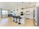 Bright kitchen with stainless steel appliances, quartz countertops, and a center island with bar seating at 2926 61St E Dr, Ellenton, FL 34222