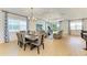 Open-concept living area with contemporary furnishings, natural light, and dining area at 2926 61St E Dr, Ellenton, FL 34222
