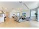Bright living area featuring an open floor plan with dining and kitchen areas, perfect for entertaining at 2926 61St E Dr, Ellenton, FL 34222