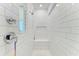 Modern walk-in shower with white subway tile, bench, and built-in niche at 2926 61St E Dr, Ellenton, FL 34222