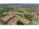 Picturesque aerial view of a beautiful Primary-planned community with waterfront homes and a golf course at 315 Heritage Isles Way, Bradenton, FL 34212