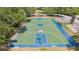 Outdoor basketball court, perfect for active recreation, featuring benches and trees at 315 Heritage Isles Way, Bradenton, FL 34212