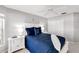 Bright bedroom with white furniture, a comfortable blue bed, and a double door closet at 315 Heritage Isles Way, Bradenton, FL 34212
