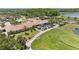 Aerial view of the community clubhouse, featuring outdoor seating and manicured landscaping at 315 Heritage Isles Way, Bradenton, FL 34212