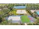 Aerial view showcases community volleyball, bocce ball, and other outdoor recreational courts for residents at 315 Heritage Isles Way, Bradenton, FL 34212