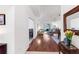 Inviting hallway with hardwood floors, leading to a living area and bedrooms at 315 Heritage Isles Way, Bradenton, FL 34212