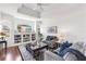 Comfortable living room with built-in shelving, contemporary decor and an abundance of natural light at 315 Heritage Isles Way, Bradenton, FL 34212