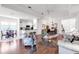Open-concept living space with dining area, stylish furnishings, and a view to the kitchen at 315 Heritage Isles Way, Bradenton, FL 34212