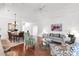 Elegant living room with hardwood floors, tray ceilings, and a view into the dining room at 315 Heritage Isles Way, Bradenton, FL 34212