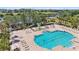 Community pool with lounge chairs, splash pad, and fenced for safety offering a relaxing atmosphere at 315 Heritage Isles Way, Bradenton, FL 34212