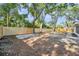 Spacious backyard featuring a wood fence, mature trees, and potential for outdoor activities and landscaping at 3193 Bellevue St, Sarasota, FL 34237