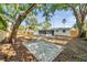 Spacious backyard boasts a concrete patio and new fence, perfect for outdoor entertaining and relaxation at 3193 Bellevue St, Sarasota, FL 34237