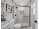 Updated bathroom offers a tiled shower with glass door, modern fixtures, and a clean, contemporary design at 3193 Bellevue St, Sarasota, FL 34237