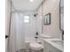 Clean bathroom featuring a shower-tub combo with white subway tiles and stylish black fixtures at 3193 Bellevue St, Sarasota, FL 34237
