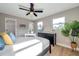 Bright bedroom features ample natural light, a ceiling fan, and a neutral color palette at 3193 Bellevue St, Sarasota, FL 34237