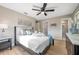 Bright bedroom with tray on bed, stylish decor, and ensuite bathroom entrance at 3193 Bellevue St, Sarasota, FL 34237