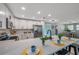 Spacious kitchen featuring a large island, stainless steel appliances, white cabinetry and an open concept to the dining room at 3193 Bellevue St, Sarasota, FL 34237