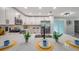 Bright kitchen island with quartz countertops, stainless appliances, and views to the living and dining areas at 3193 Bellevue St, Sarasota, FL 34237