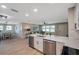 Bright, updated kitchen featuring a large island with breakfast bar, stainless steel appliances, and easy access to living areas at 3193 Bellevue St, Sarasota, FL 34237