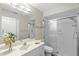 Bright bathroom featuring a glass-enclosed shower, vanity with sink, and neutral color scheme at 3263 Woodberry Ln # Lot 15, Sarasota, FL 34231
