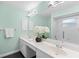 Bathroom boasts a double sink vanity, large mirror, and a walk-in shower with grab bars at 3263 Woodberry Ln # Lot 15, Sarasota, FL 34231