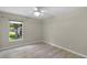 Bedroom with light-colored walls, wood-look floors and window for natural light at 3263 Woodberry Ln # Lot 15, Sarasota, FL 34231
