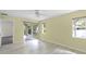 Bright bedroom with sliding glass door to the lanai and neutral walls and wood-look floors at 3263 Woodberry Ln # Lot 15, Sarasota, FL 34231