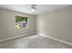 Bedroom with light-colored walls, wood-look floors and window for natural light at 3263 Woodberry Ln # Lot 15, Sarasota, FL 34231