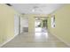 Bedroom featuring wood-look floors, neutral paint, access to the lanai, and a ceiling fan at 3263 Woodberry Ln # Lot 15, Sarasota, FL 34231