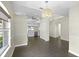 Dining room featuring dark tile floors, a chandelier, with kitchen views at 3263 Woodberry Ln # Lot 15, Sarasota, FL 34231