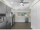 Modern kitchen with stainless steel appliances, ample cabinet space, and tile floors at 3263 Woodberry Ln # Lot 15, Sarasota, FL 34231