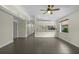 Bright living room features gray tile flooring, neutral walls, and a window overlooking the front yard at 3263 Woodberry Ln # Lot 15, Sarasota, FL 34231