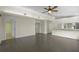 Spacious living room with tile floors, neutral paint, and a ceiling fan at 3263 Woodberry Ln # Lot 15, Sarasota, FL 34231